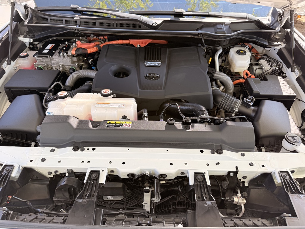 Engine bay after detailing — clean with dressed, restored plastics