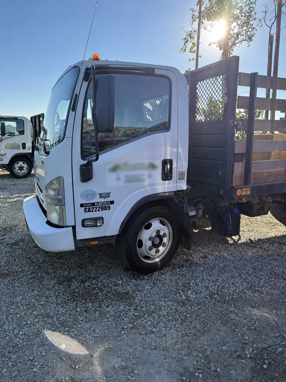 Commercial landscape truck receiving on-site fleet detailing