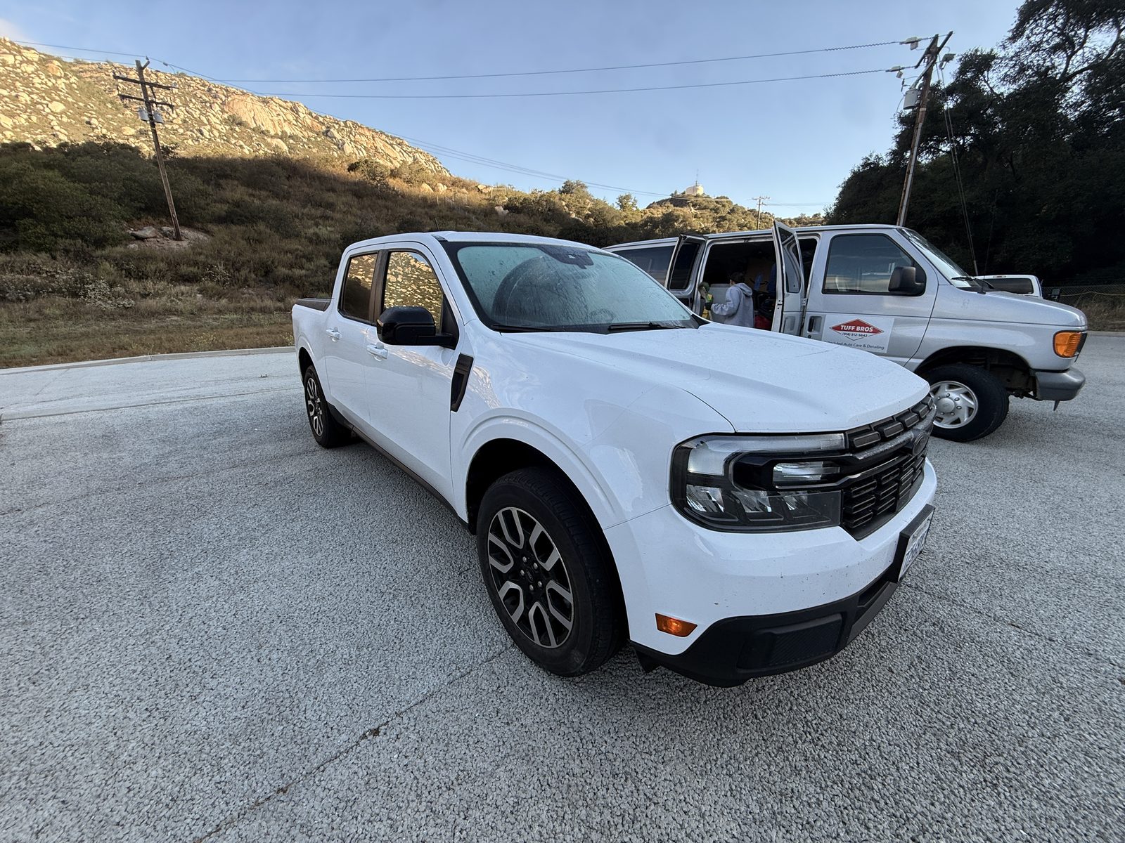 White service pickup and Tuff Bros detailing van at an on-site fleet detail