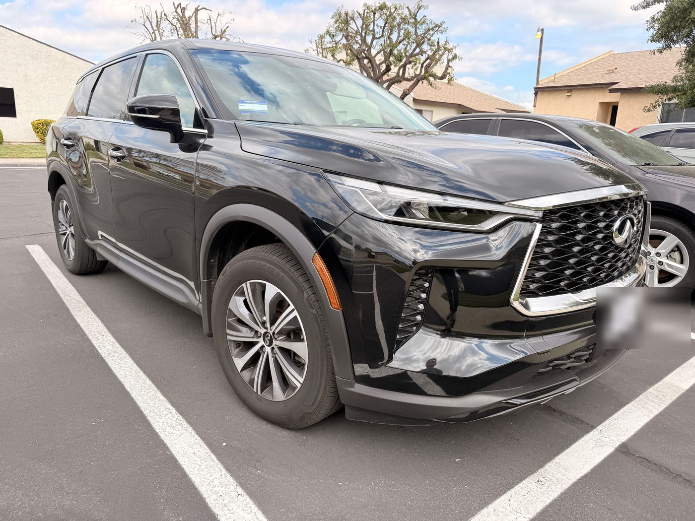 Black Infiniti QX80 SUV detailed to a deep shine